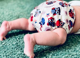 Cloth Diapering: No Intimidation Necessary baby legs in a patriotic owl cloth diaper