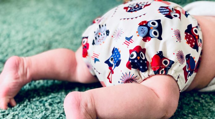 Cloth Diapering: No Intimidation Necessary baby legs in a patriotic owl cloth diaper