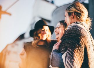 Making Friends: Military Spouse Edition priscilla-du-preez via unsplash three women laughing