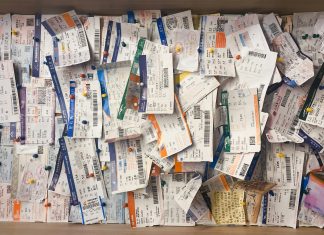 Ticket System: How To Start One in Your Home billow926 via unsplash tickets hung on a cork board