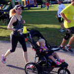 Kindra and her Baby Trend Expedition at a race