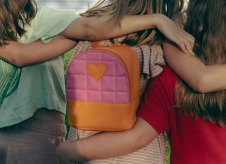 nellie-adamyan via unsplash three kids with their arms around each other