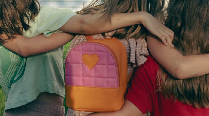 A Letter to My Son on His Last Day of Daycare nellie-adamyan via unsplash three kids with their arms around each other