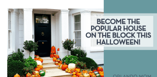 Become the Popular House on the Block This Halloween! Andrei Ianovskii via Unsplash black front door with green bushes and pumpkins lining the stairs with words 'Become the popular house on the block this Halloween!' on the right