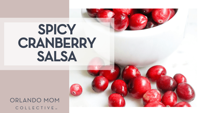 Melissa Di Rocco via Unsplash cranberries in a white bowl and some spilled out on a white countertop with 'spicy cranberry salsa' on the left.