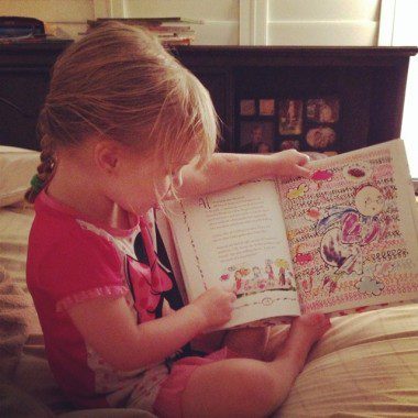 My daughter showing us how to read.