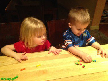 The kids sorting and counting M&Ms.