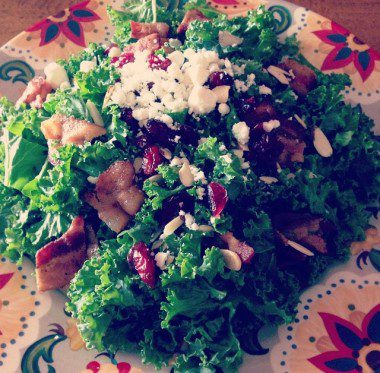 Massaged kale salad with bacon, feta, almonds and dried cranberries