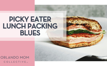 Picky Eater Lunch Packing Blues Eaters Collective via Unsplash hame sandwich cut in quarter from the side with 'Picky Eater Lunch Packing Blues' on the left