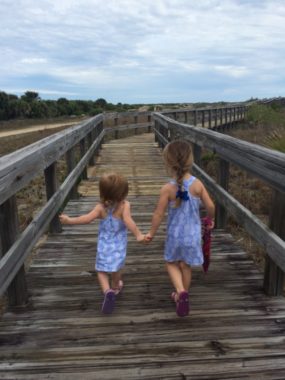 Em and Mak on beach boardwalk