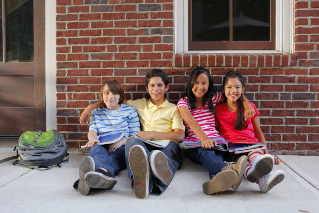 Kids-Sitting-Sidewalk