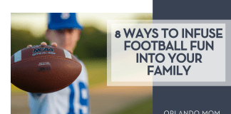 We’ve Got Spirit, Yes We Do… How ‘Bout You?! 8 Ways to Infuse Football Fun into Your Family JV via Unsplash teen boy in a white and blue jersey with a blu hat on holding a football in front of him with '8 Ways to Infuse Football Fun into Your Family' on the right