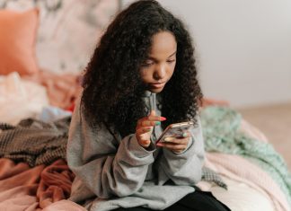teen girl on her phone, teen slang parents should know 2025