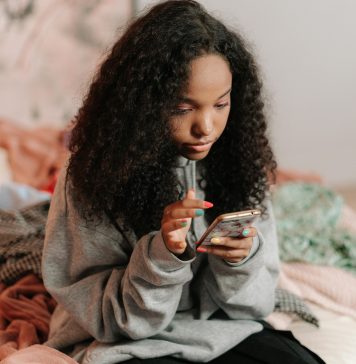 Teen Slang Parents Should Know 2025: A Gen Alpha – Z Dictionary teen girl on her phone, teen slang parents should know 2025