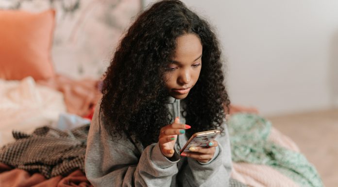 teen girl on her phone, teen slang parents should know 2025