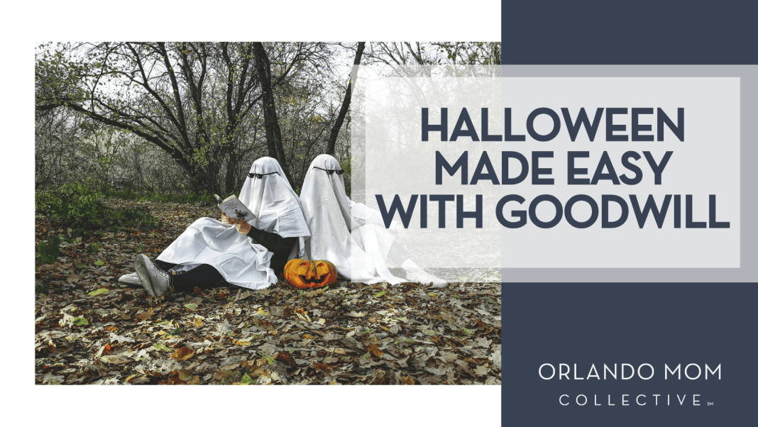Halloween made easy with Goodwill Vadim Bogulov via Unsplash two people in ghost costumes reading books sitting back to back in the fall woods with a pumpkin between them with 'Halloween made easy with Goodwill' on the right