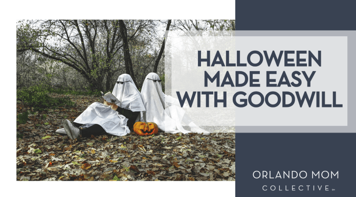 Vadim Bogulov via Unsplash two people in ghost costumes reading books sitting back to back in the fall woods with a pumpkin between them with 'Halloween made easy with Goodwill' on the right