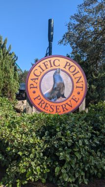 Pacific Point Preserve sign on orange background with words in circle around sea lion picture