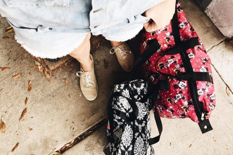 two feet and two patterned bags