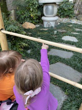 two girls pointing at the interactive table in Japan