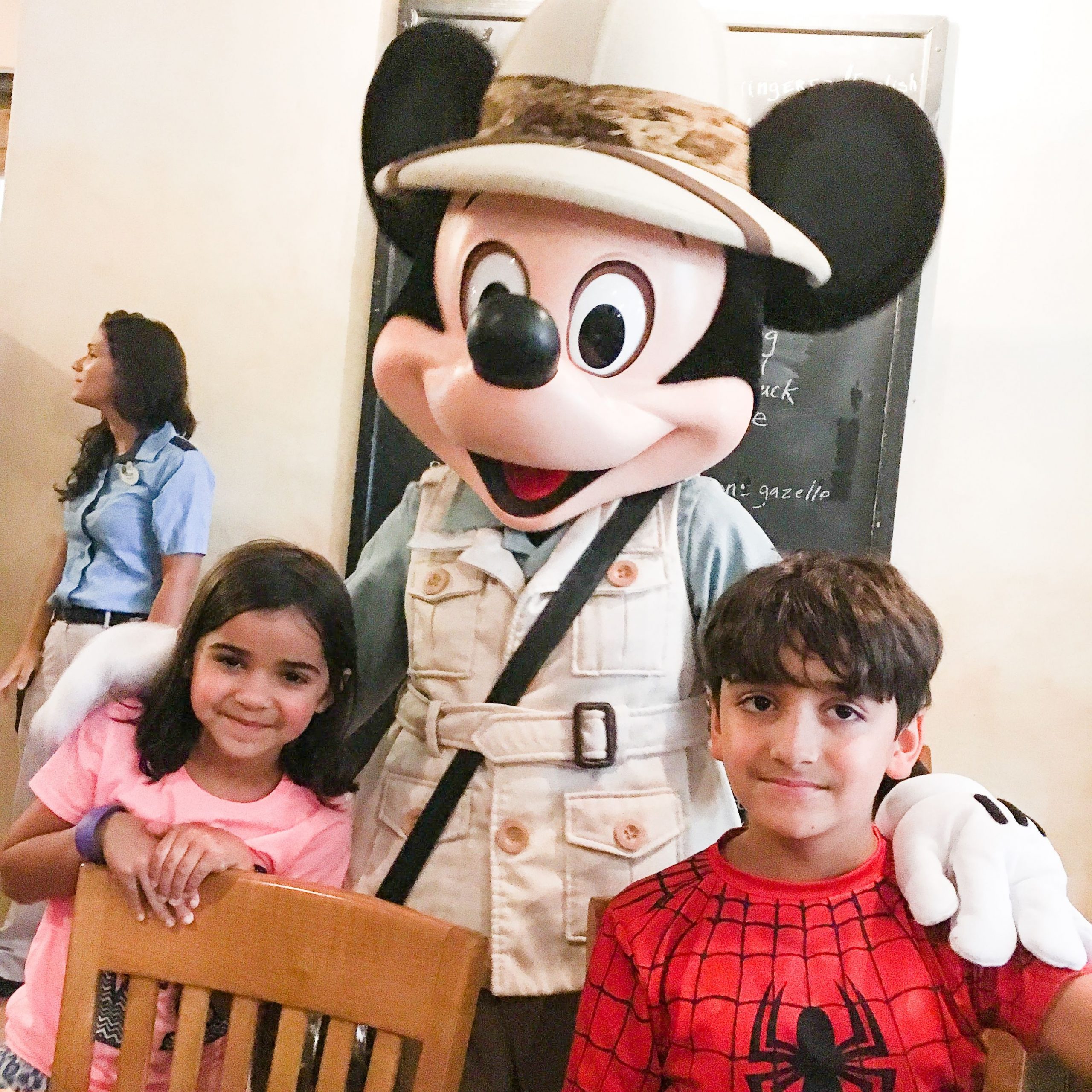 Safari Mickey Mouse at Tusker House Restaurant Disney's Animal Kingdom with two kids and cast member in background