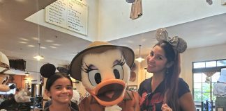 Mom and daughter with Daisy Duck at Disney's Animal Kingdom restaurant Tusker House