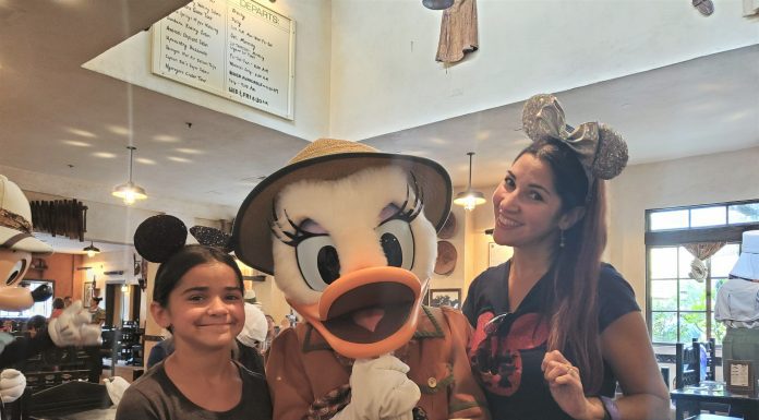 Mom and daughter with Daisy Duck at Disney's Animal Kingdom restaurant Tusker House
