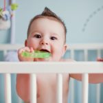 Little baby boy with teether