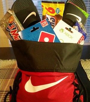 Easter Basket made from athletic bag with flip flops, candy and a gift card coming out of the top