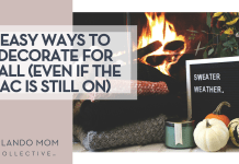 Rikkia Hughes via Unsplash fire in a fireplace with folded sweaters, a candle, little pumpkins and a sign that says 'sweater weather' in front of the fire with 'Easy Ways to Decorate for Fall (Even If The AC Is Still On)' on the left