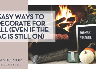 Easy Ways to Decorate for Fall (Even If The AC Is Still On) Rikkia Hughes via Unsplash fire in a fireplace with folded sweaters, a candle, little pumpkins and a sign that says 'sweater weather' in front of the fire with 'Easy Ways to Decorate for Fall (Even If The AC Is Still On)' on the left