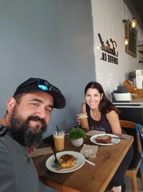 Smiling couple coffee date at Foxtail Coffee in Windermere, Florida