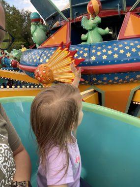 little girl waving on TriceraTop Spin