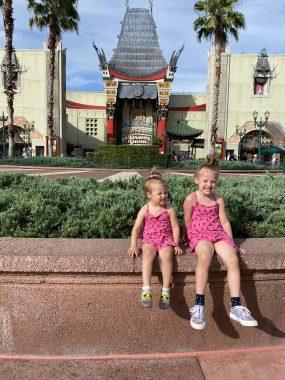 two girls in front of mickey and Minnie's runaway railway