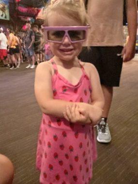 little girl with purple glasses on