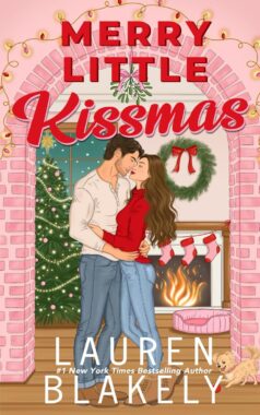 Merry Little Kisses by Lauren Blakely book cover via Amazon - man and woman kissing with a Christmas tree, wreath and fireplace behind them.