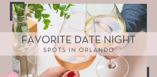 Fave Date Night Spots in Orlando micheile henderson via unsplash image of two wine glasses cheersing with plant next to it with text ' favorite date night spots in orlando' over top of picture