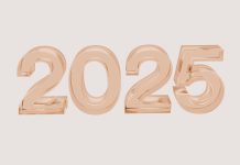 2025 in bubble numbers in rose gold on light brown background