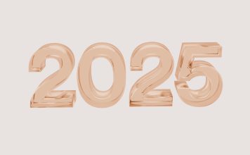 2025 in bubble numbers in rose gold on light brown background