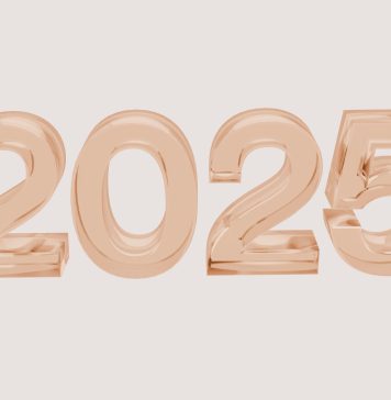 2025 in bubble numbers in rose gold on light brown background