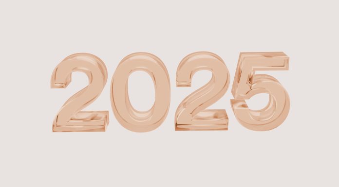 2025 in bubble numbers in rose gold on light brown background