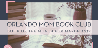Orlando Mom Book Club: Book of the Month for March 2024 Freestocks via unsplace image of stack of books, coffee mug, open book, and flowers in a vase on a table with words 'Orlando Mom book club book of the month for march 2024' over top