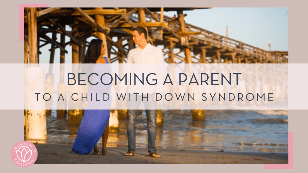 a pregnant mom in blue dress with man in jeans and white shirt next to her in front of a wooden bridge and water with 'becoming a parent to a child with Down syndrome' in text on top of photo