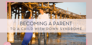 Becoming a Parent to a Child with Down Syndrome a pregnant mom in blue dress with man in jeans and white shirt next to her in front of a wooden bridge and water with 'becoming a parent to a child with Down syndrome' in text on top of photo