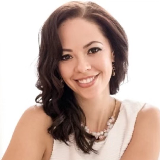 woman in cream top with necklace and dark brown hair white background