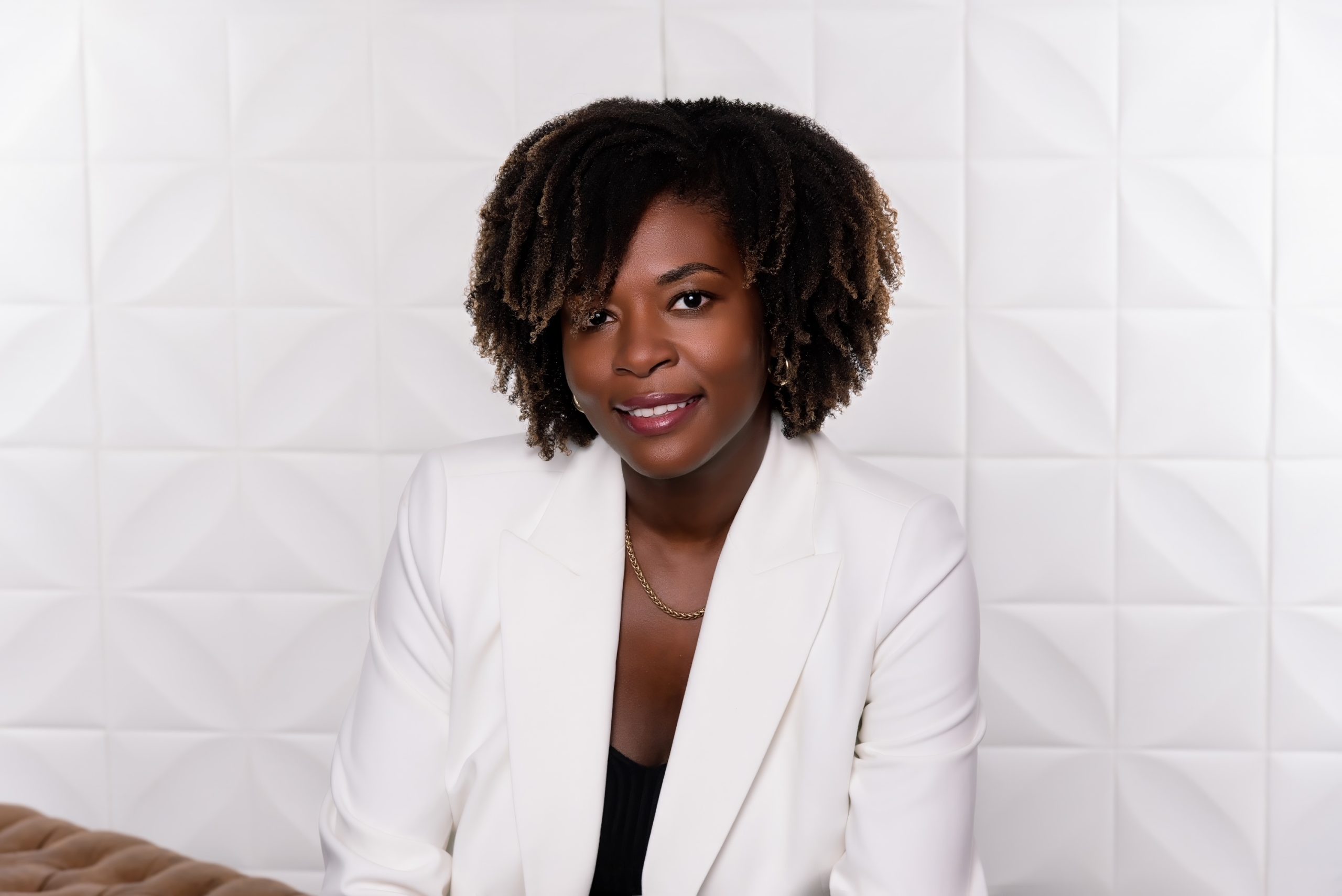 woman smiling at the camera, black history month women in business