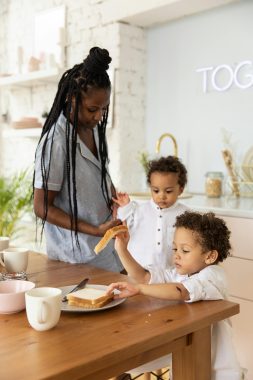 woman giving food to her kids; breaking cycles