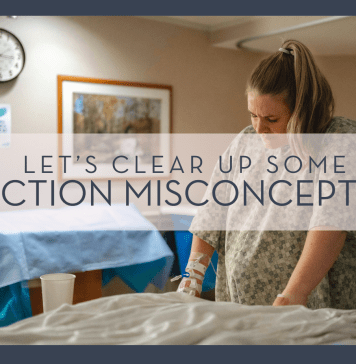 Jimmy Conniver via Unsplash image of woman in hospital gown holding onto bed with clock and picture behind her and words 'let's clear up some c-section misconceptions' overtop