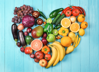 Fruits and vegetables organized by color in shape of a heart