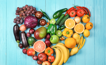 Fruits and vegetables organized by color in shape of a heart